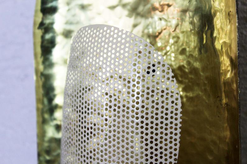 Hammered brass and perforated metal sconce