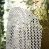 Hammered brass and perforated metal sconce