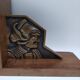 Pair of Breton couple bookends in bronze and wood.