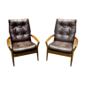 Paire de fauteuils des années 70 en teck et simili cuir