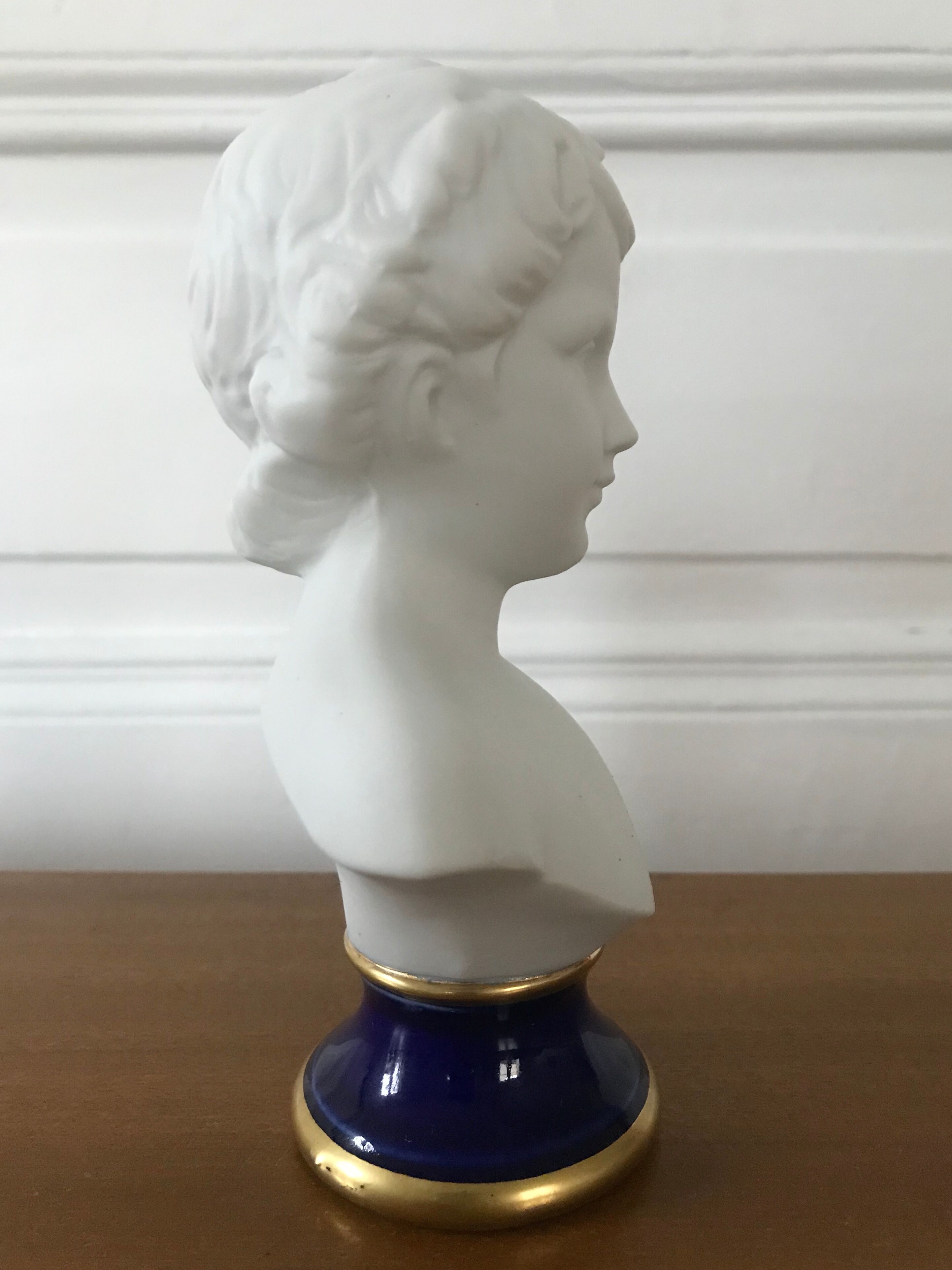 Ancient statuette bust in biscuit