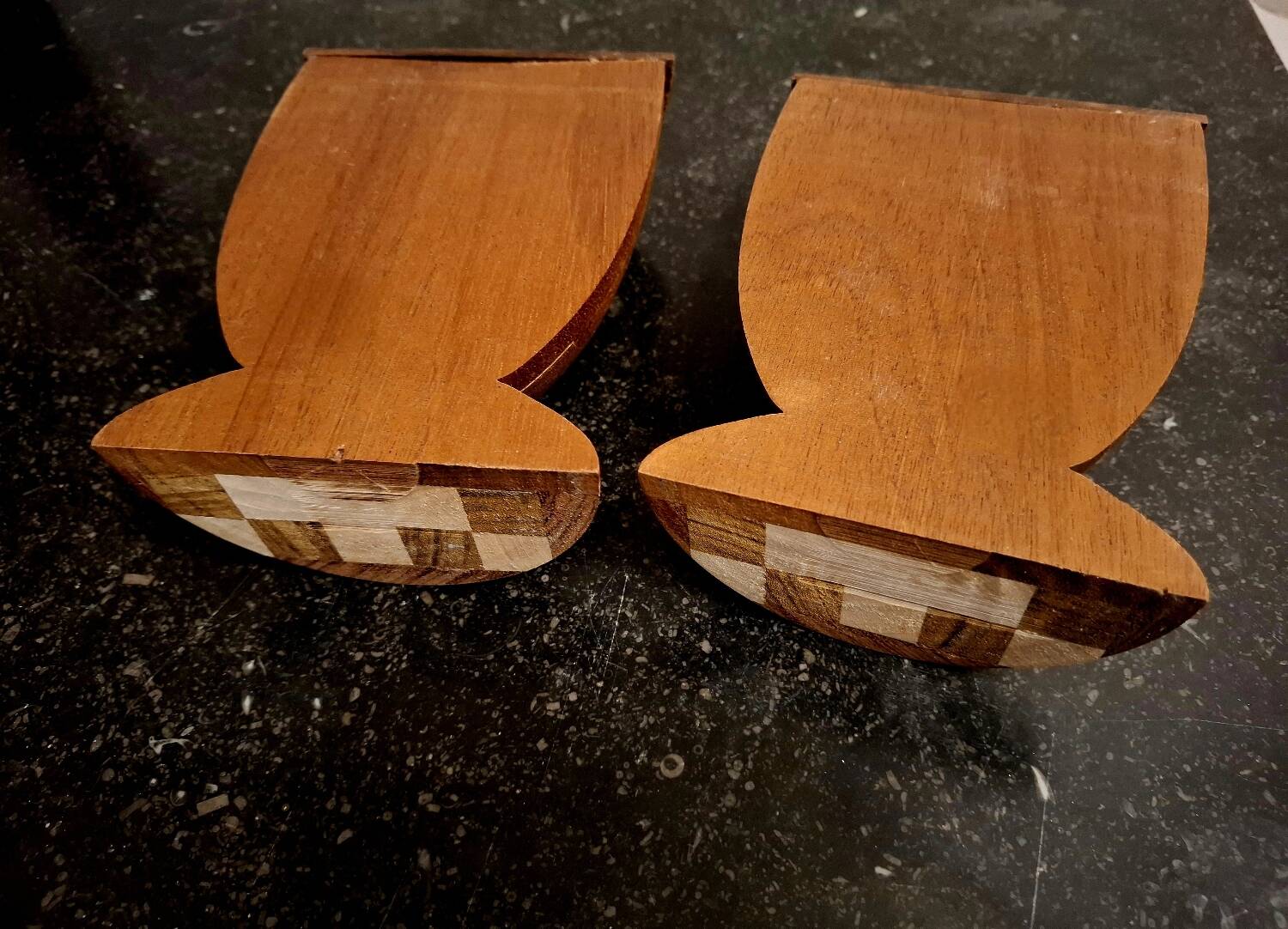 Bookends in exotic wood marquetry in the shape of a tambourine.