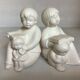 Pair of bookends with a matte white glaze for children.