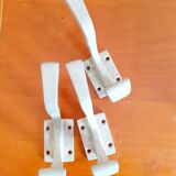 Set of three cast aluminum patères