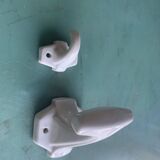 Two white porcelain coat hooks, one small and one larger, old