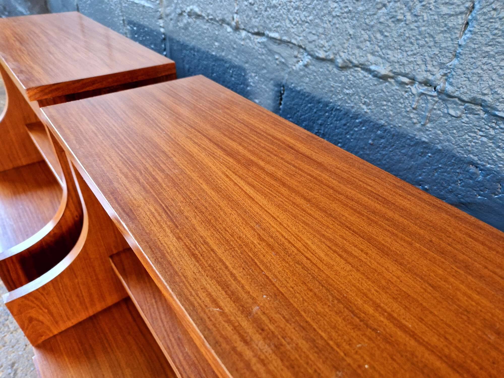 Pair of rosewood bedside tables, 1960s-70s