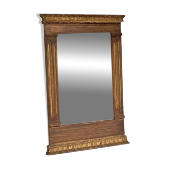 Small golden mirror in Louis XVI style.