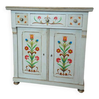 Antique low polychrome sideboard with floral decoration.