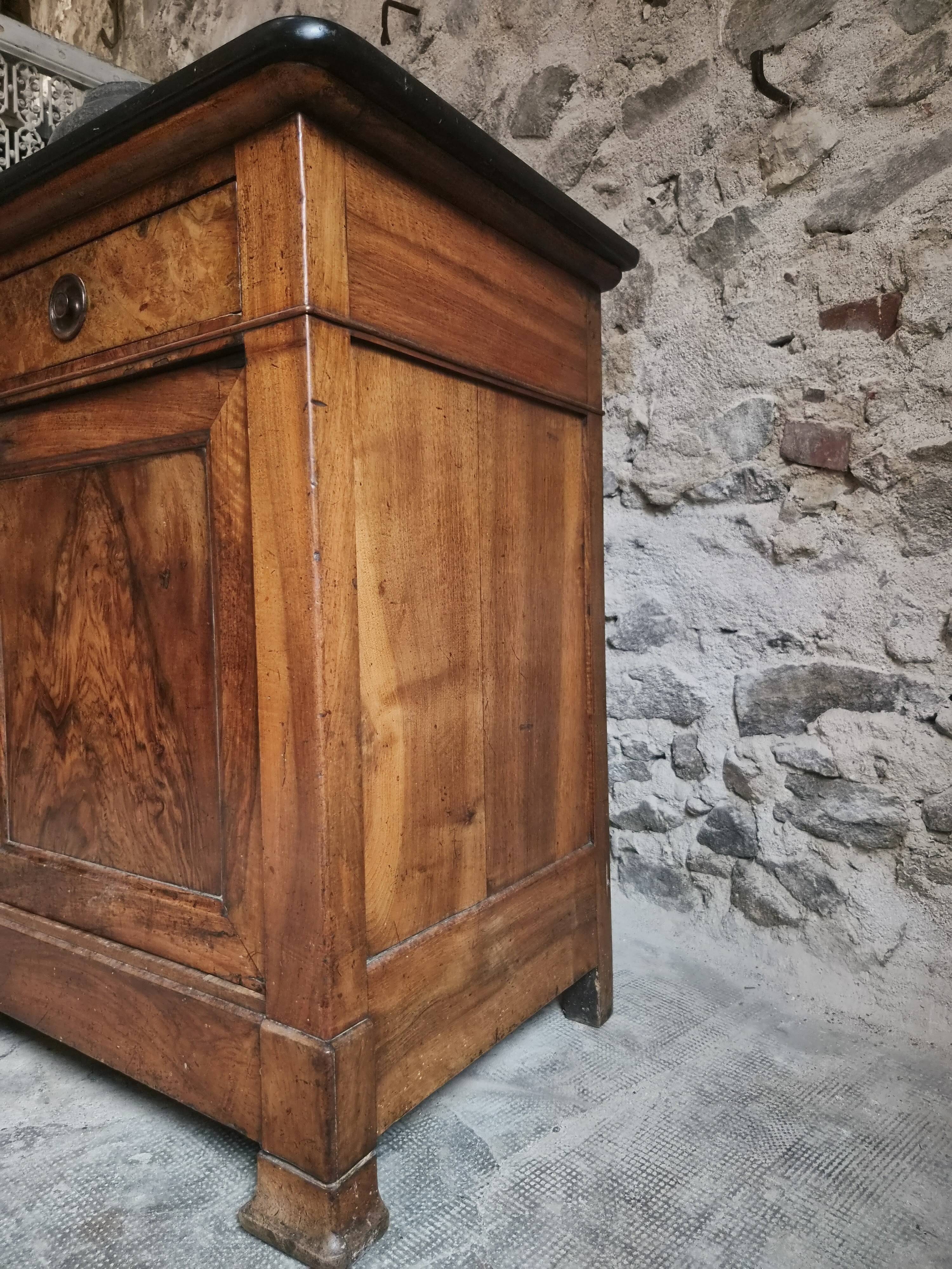 French Louis Philippe walnut buffet with black marble top, France, circa 1840–1860.
