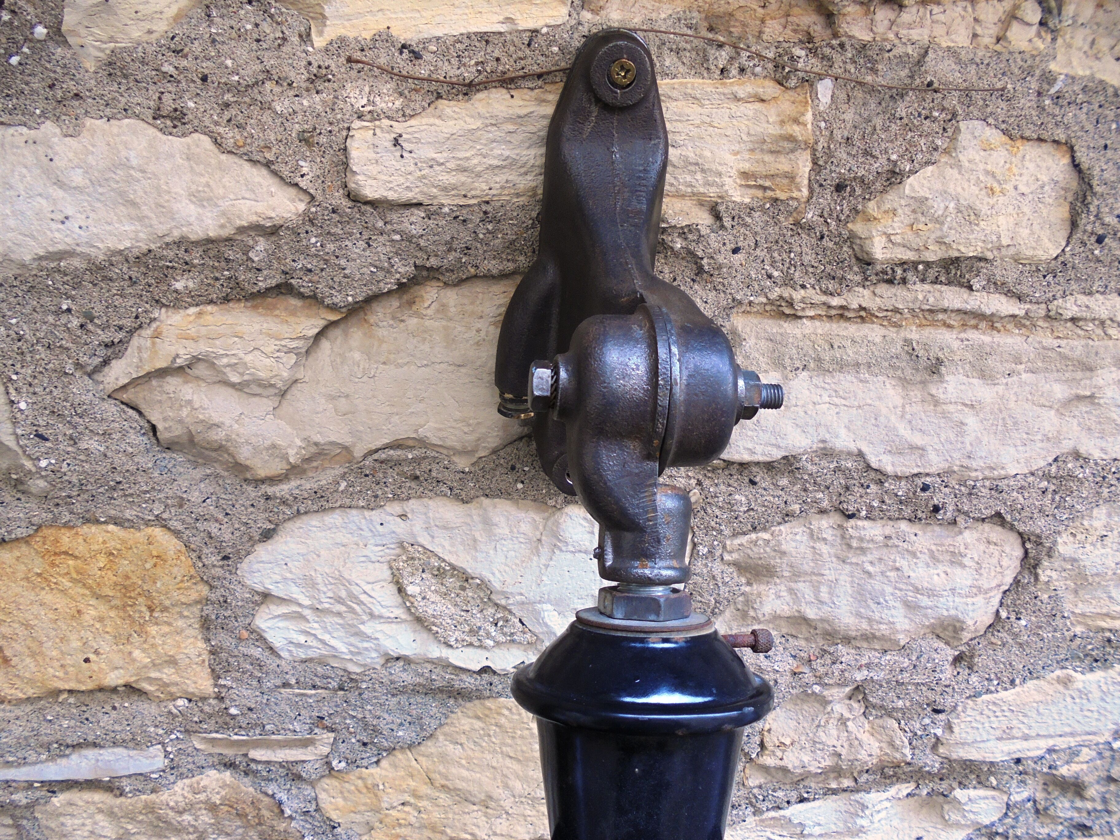 Antique cast iron and enamel wall lamp from the 1930s