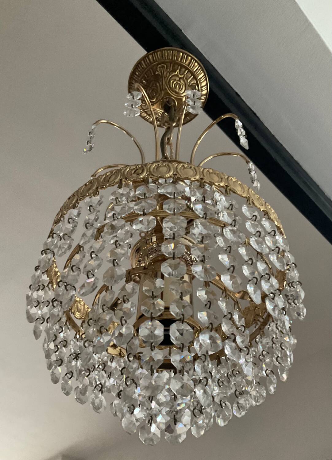 Cascade chandelier with crystal and brass tassels