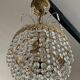 Cascade chandelier with crystal and brass tassels
