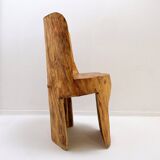 Brutalist sculptural chair in solid oak in wabi-sabi style.
