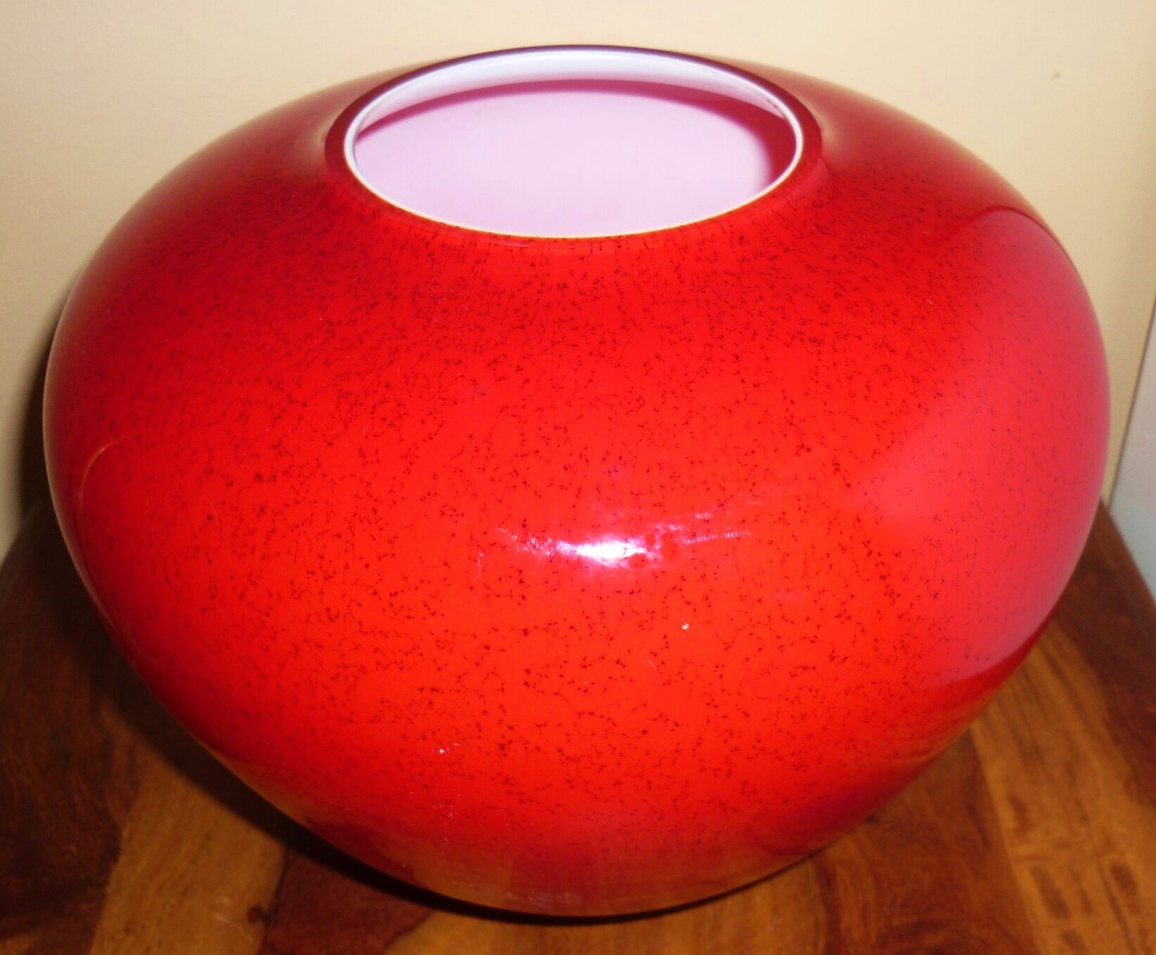 Pot-bellied, art deco vase in speckled ruby red multi-layered glass, white interior