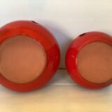 Pair of red Scandinavian candle holders.