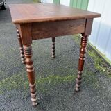 Wooden side table with turned legs