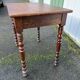 Wooden side table with turned legs