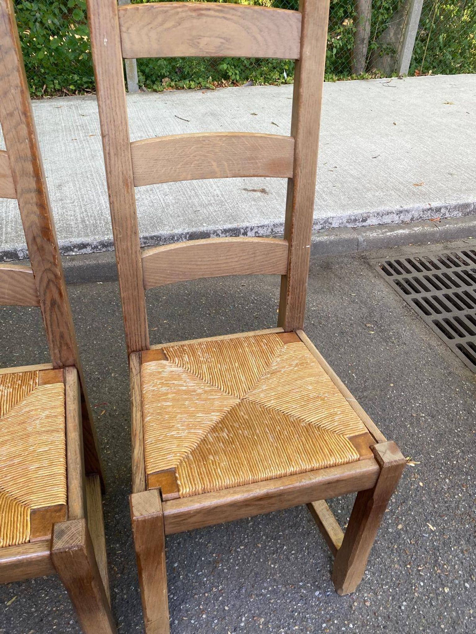 8 wooden dining chairs with straw seats, farmhouse style, high back.