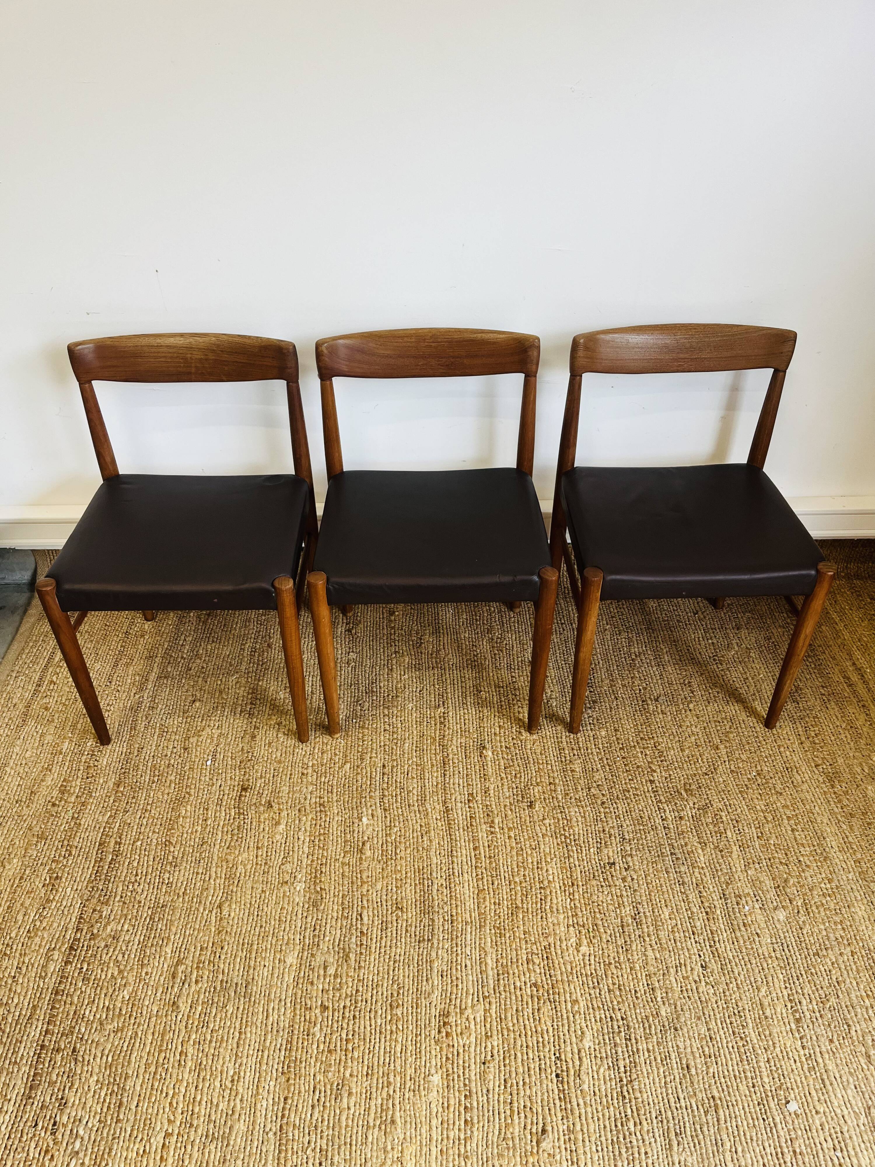 3 vintage Scandinavian chairs in teak and brown leatherette
