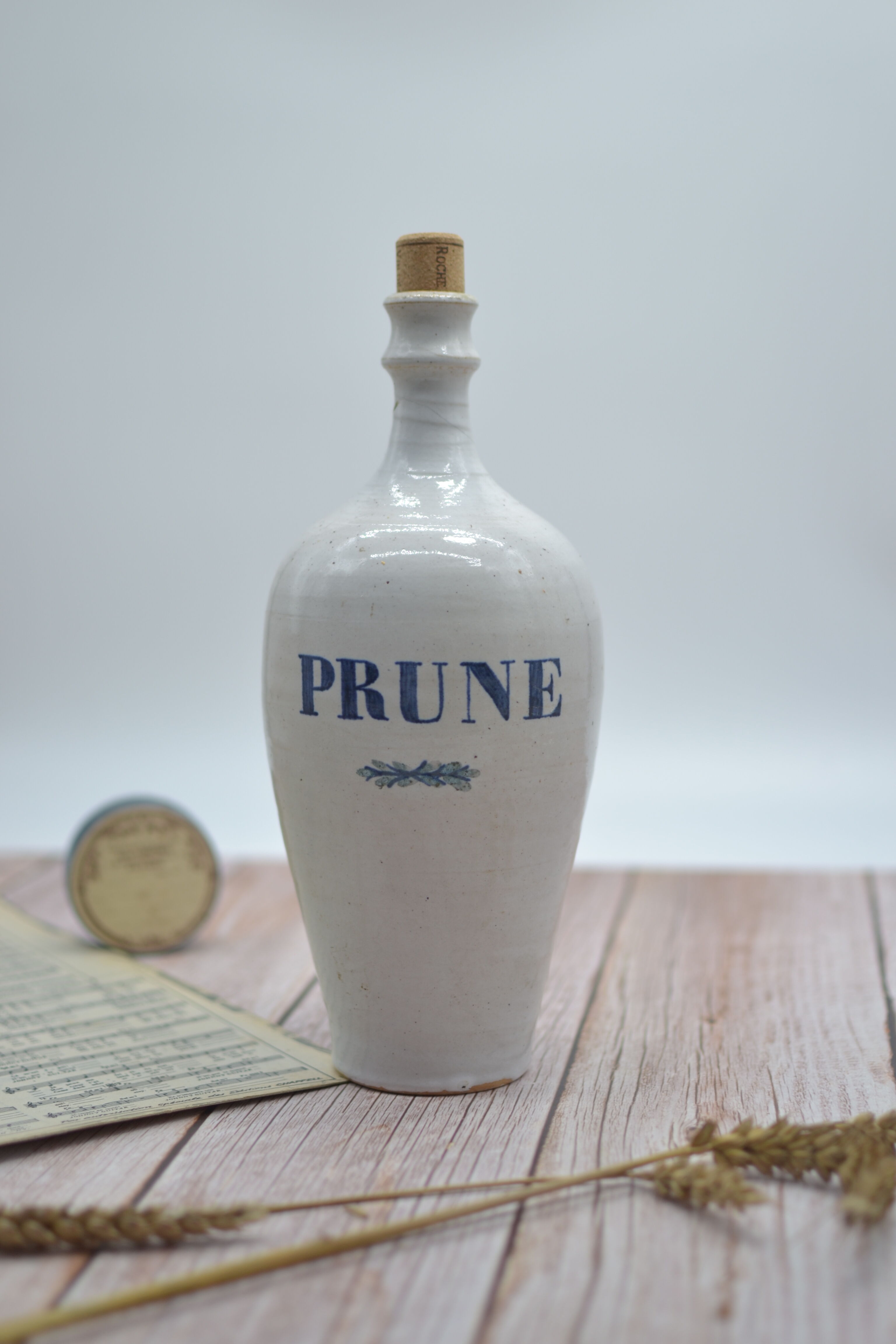 Vintage plum stoneware bottle