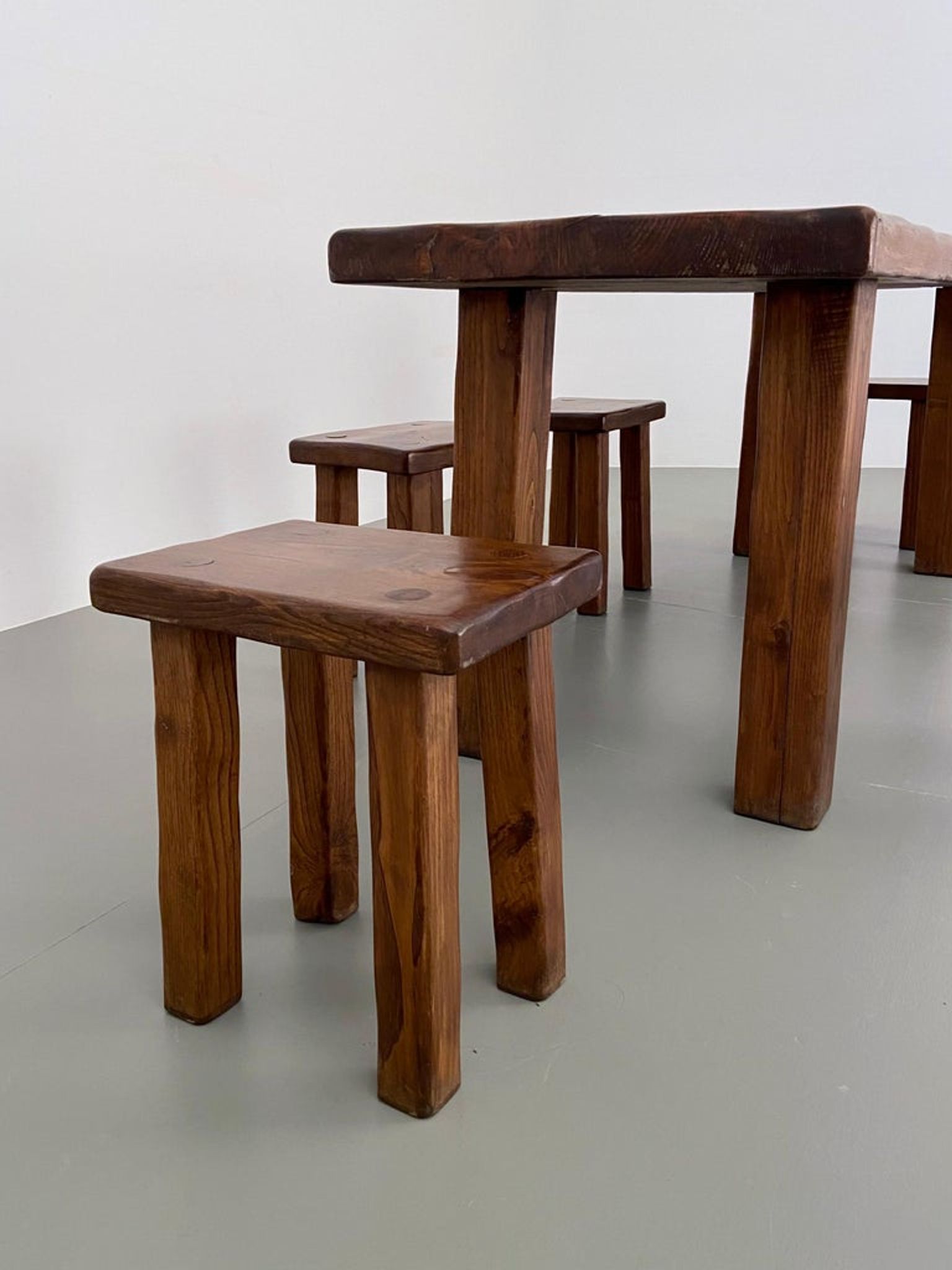 Solid elm dining set including 6 stools France 1970s