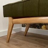 Wooden bench and green fabric