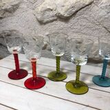 Antique and rare! Sold in a set of 12 colorful twisted stemmed glasses engraved with flowers and leaves