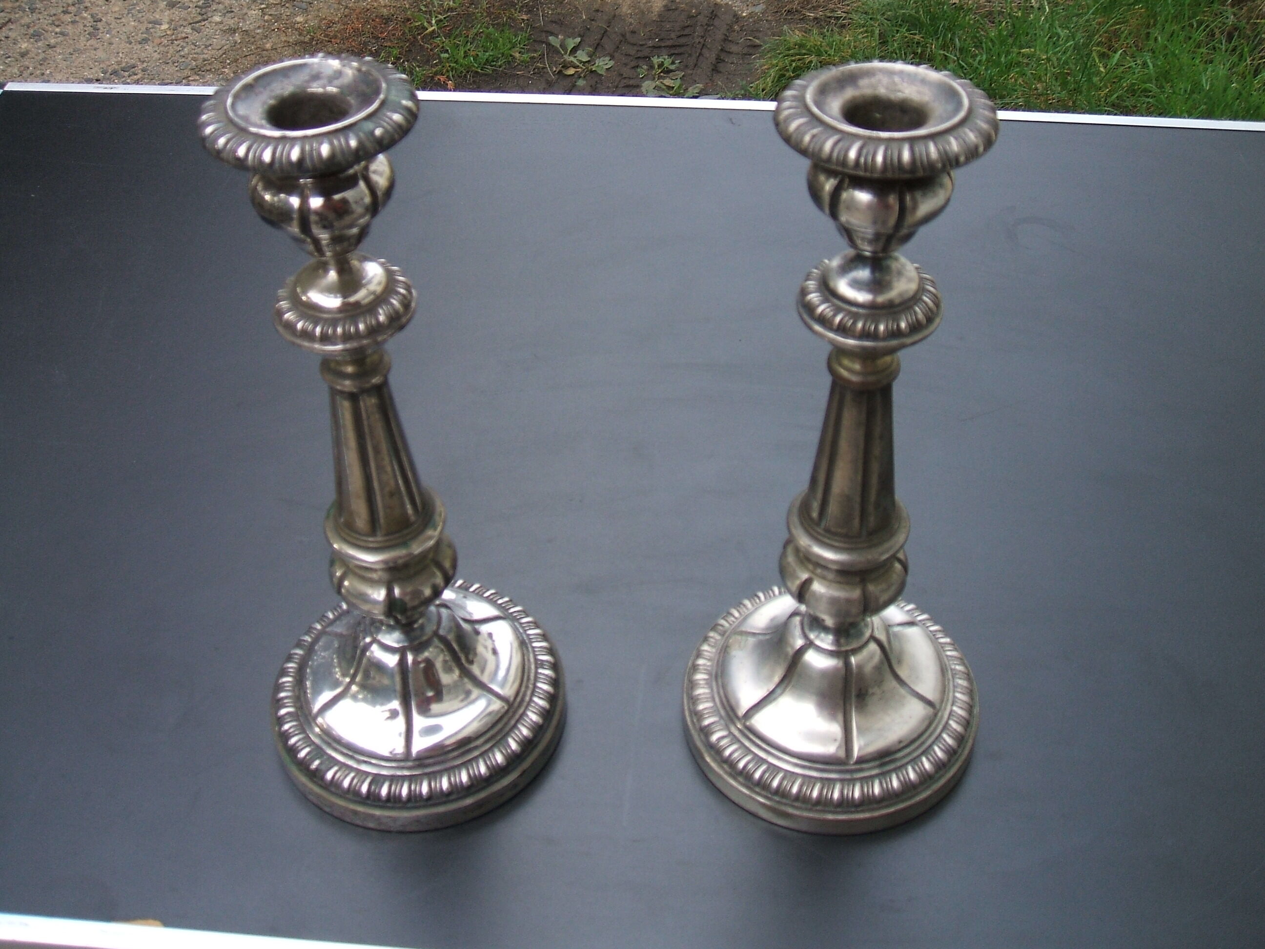 Pair of silver metal candle holders