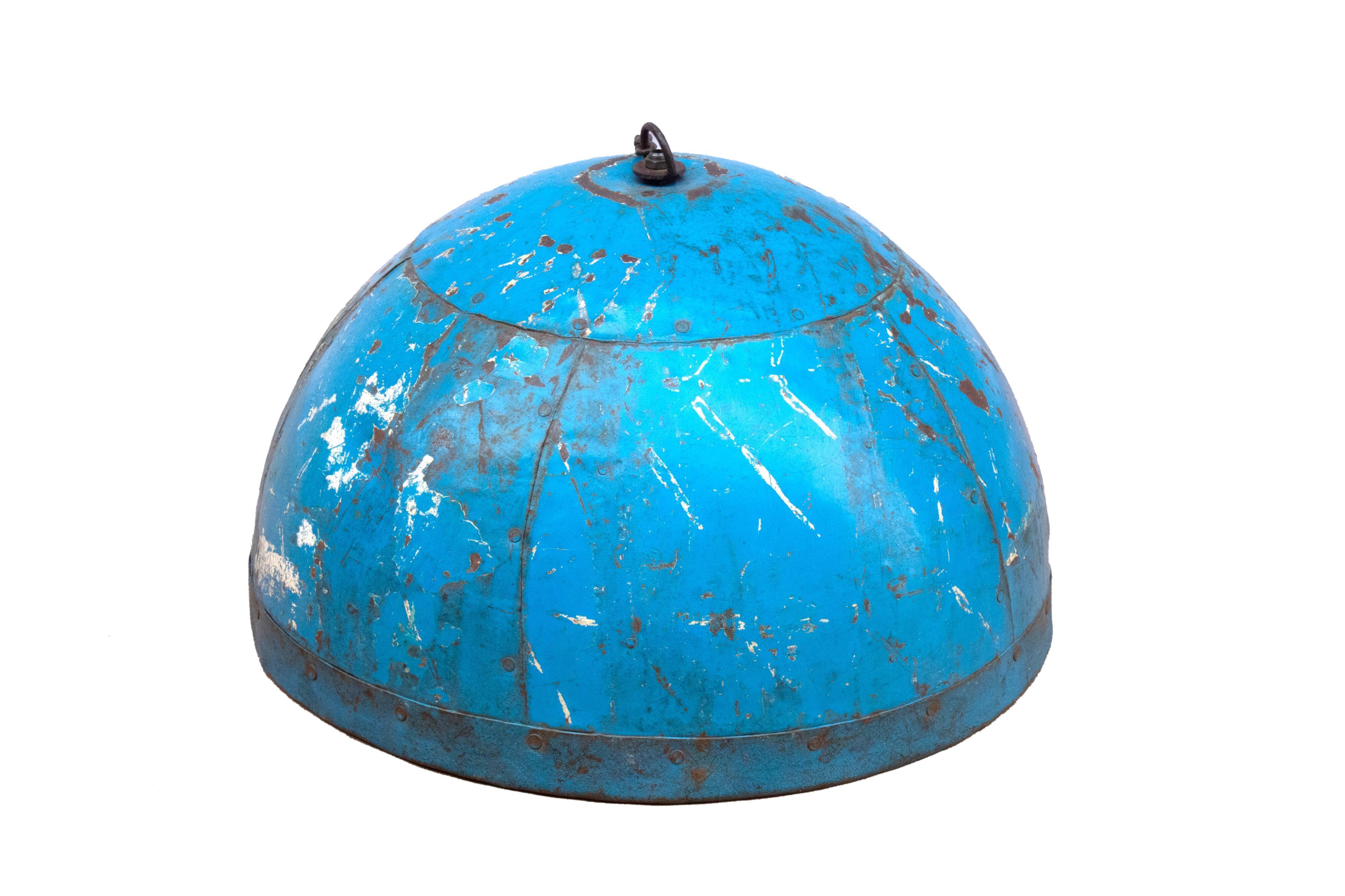 Metal hanging with its original blue colour