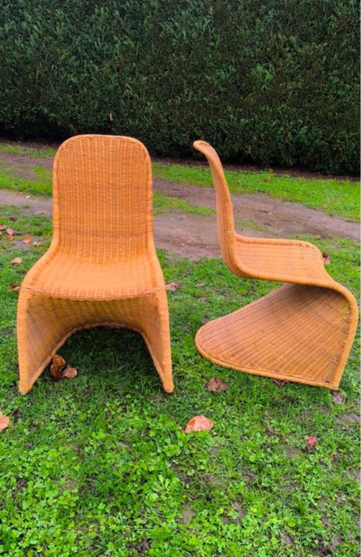 Pair of rattan chairs in the style of Verner Panton