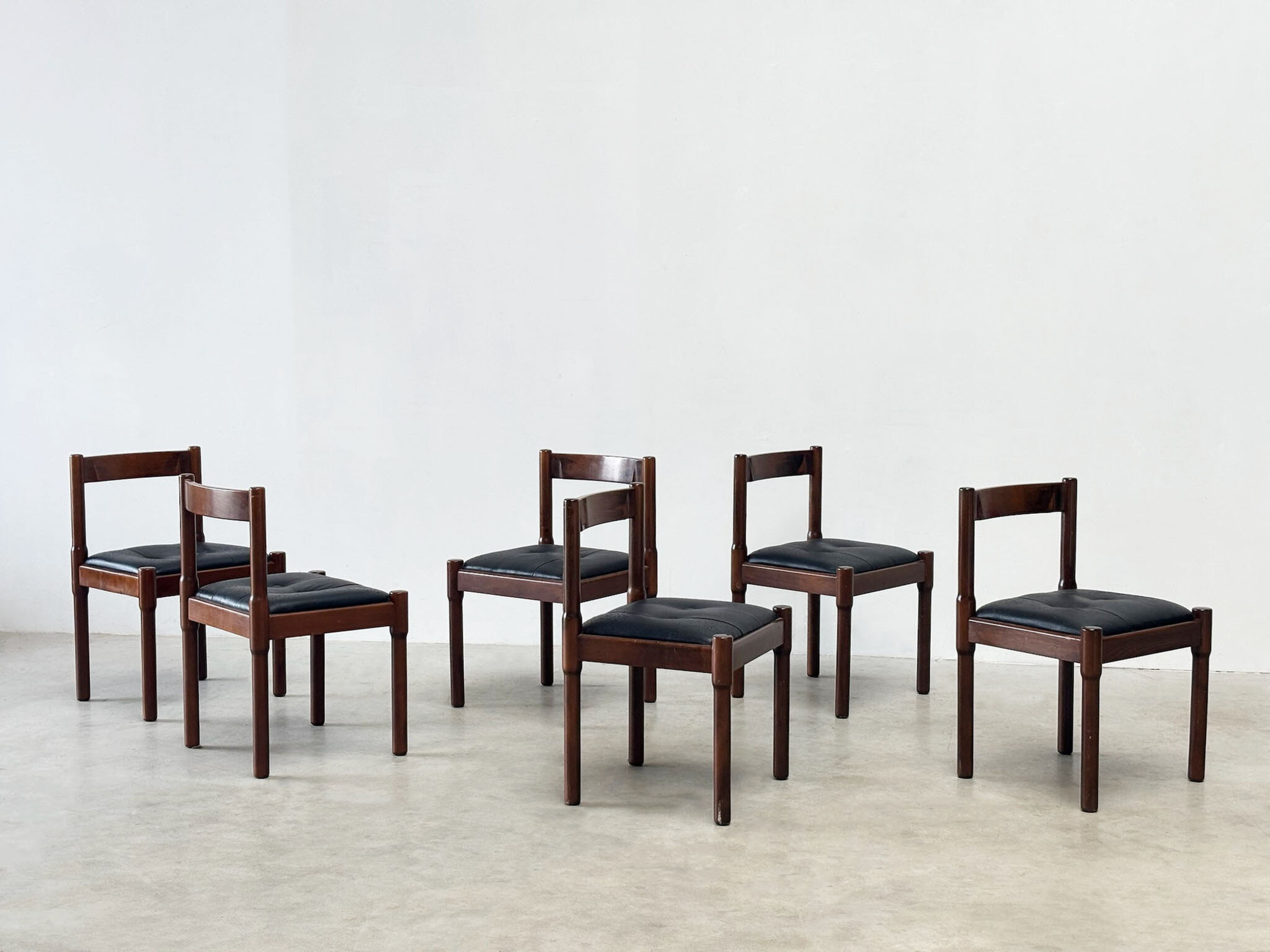 Set of six leather "Carimate" dining chairs by Vico Magistretti for Cassina