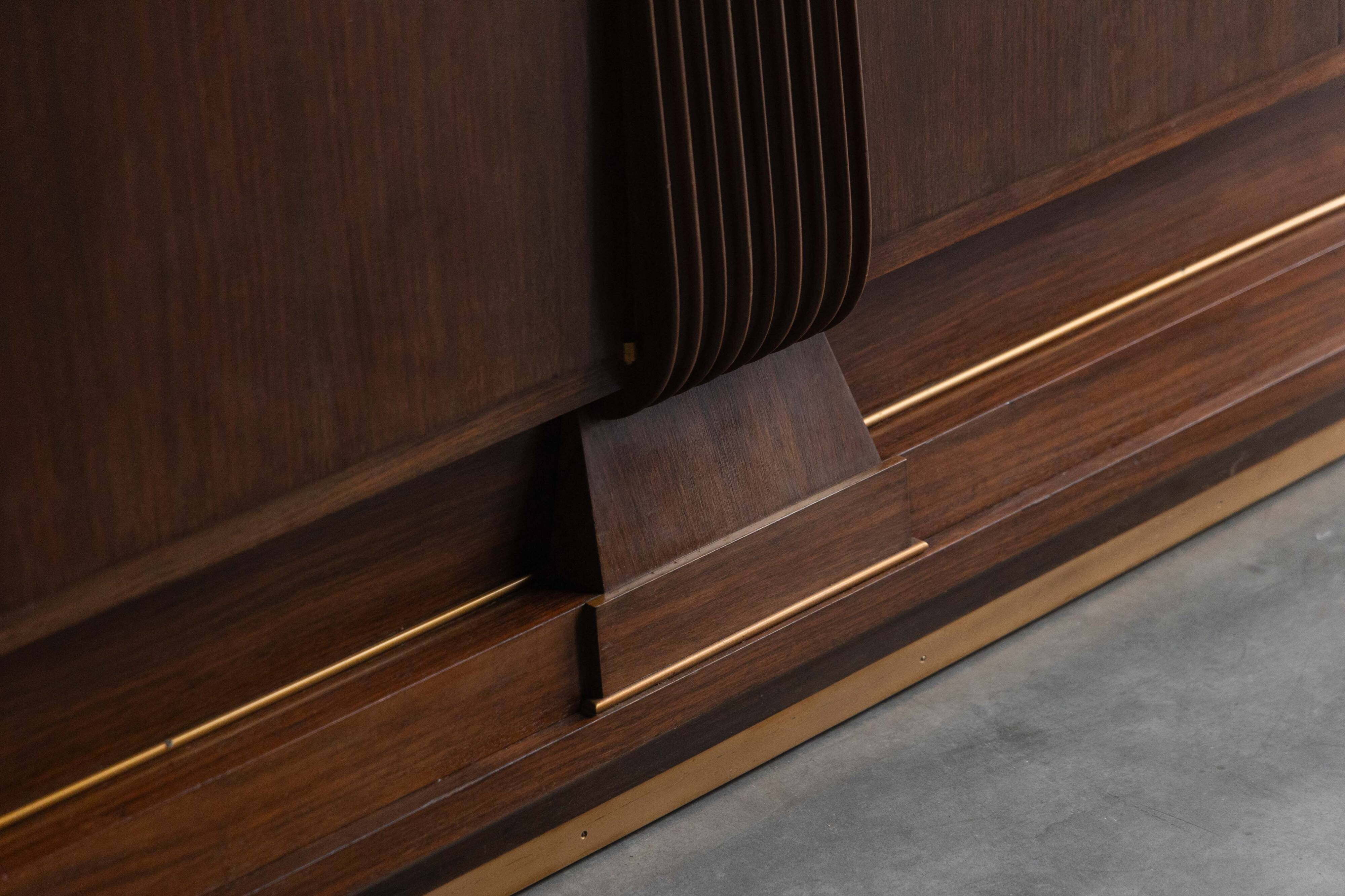 Art Deco walnut sideboard with brass details and sculptural base, France, 1930s