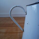 White enamelled metal broc