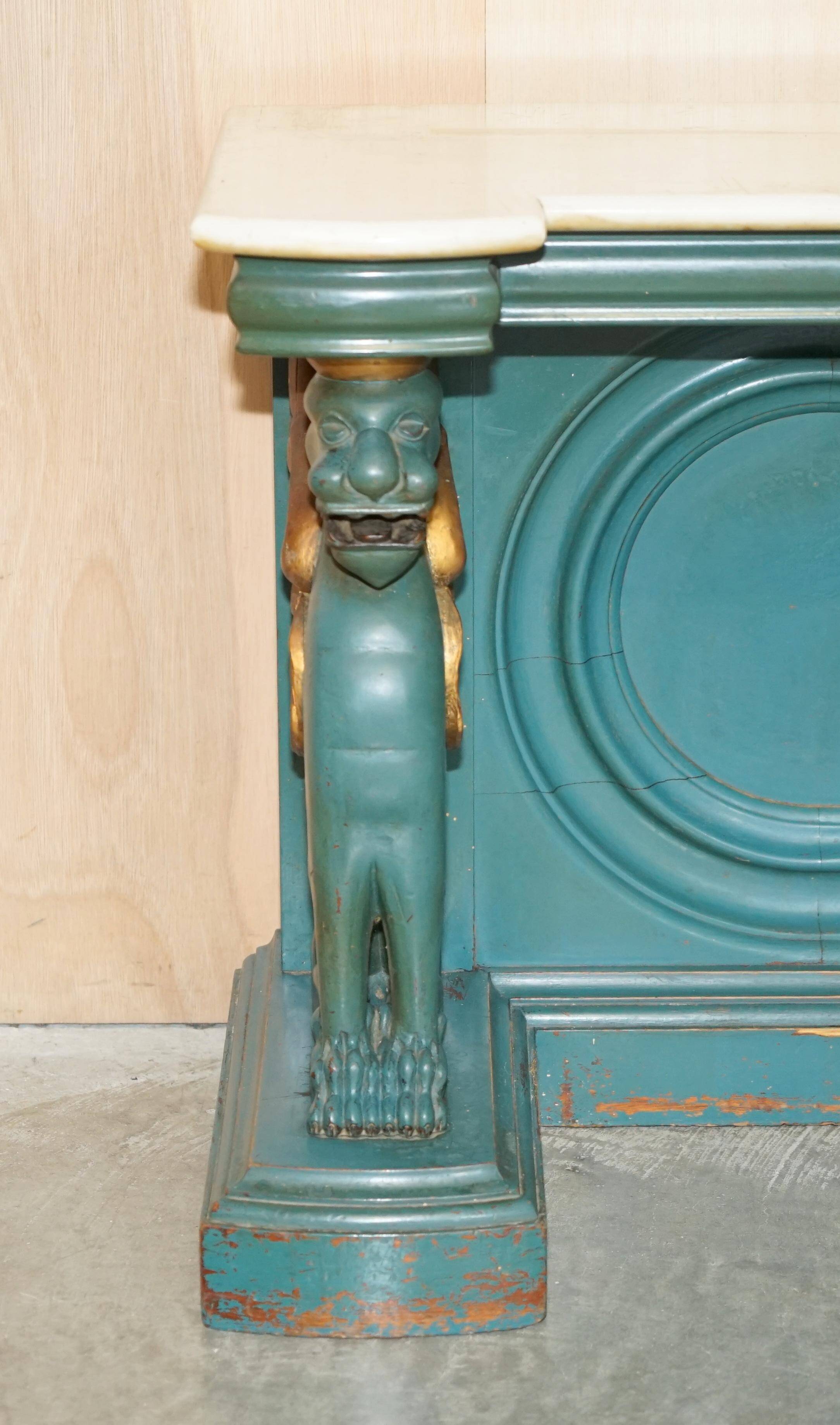 Antique hand-carved console circa 1880 with a marble top.