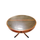 Round Regency dining table in mahogany and green leather with extensions - 20th century