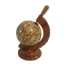 Small globe supporting olive wood