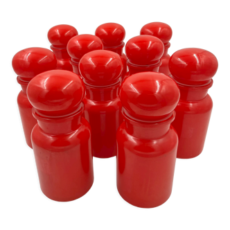 Set of ten red glass jars