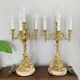 Pair of gilt bronze chandeliers, marble bases.