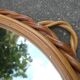 Small round mirror with rattan frame, vintage 70s