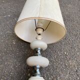 Space age bedside lamp in off-white wood with a metal band.