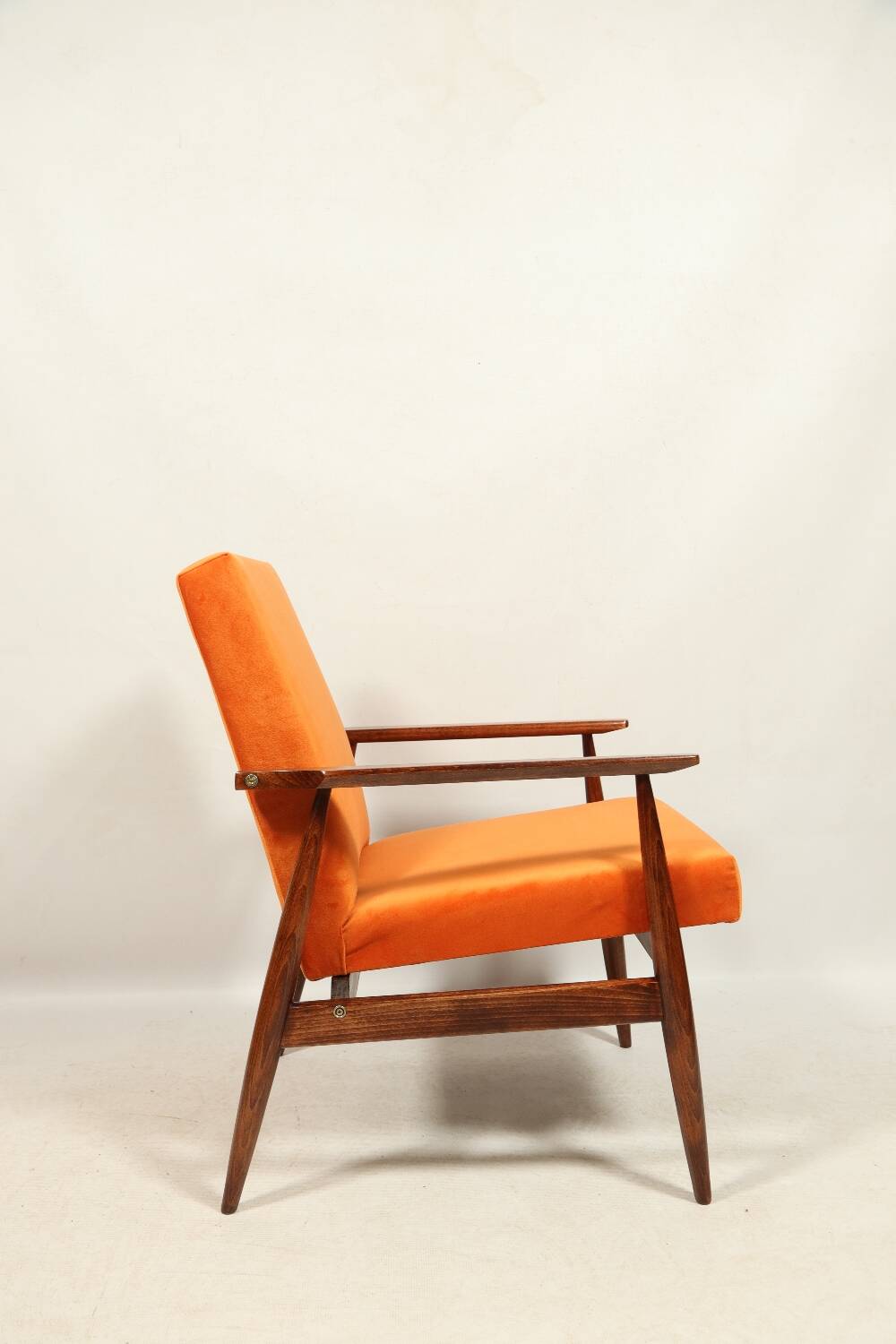 Modern armchair in orange papaya velvet with dark brown wood, 1970s Scandinavian style.
