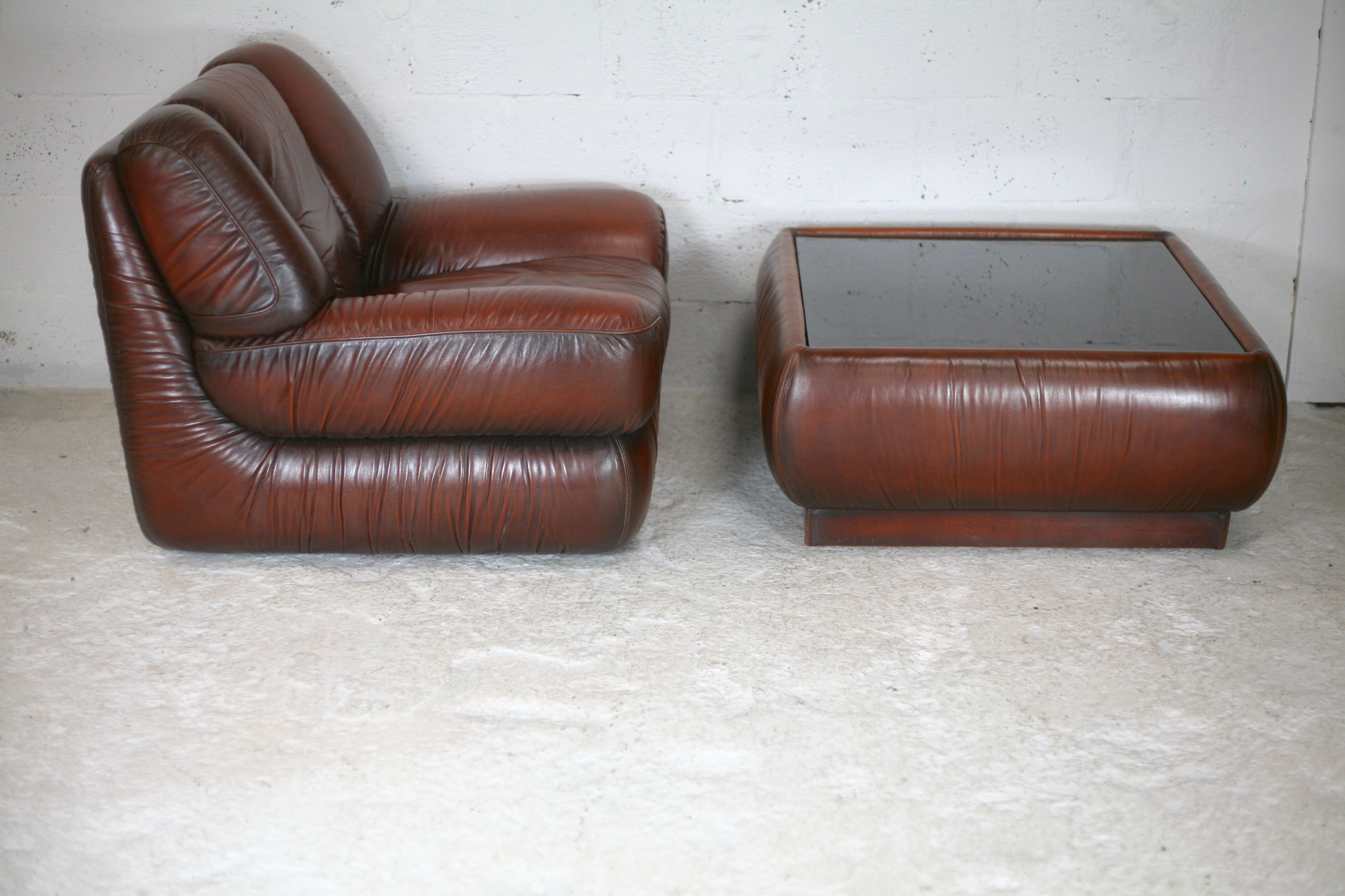 Leather armchair and coffee table set, Italy, circa 1970. Space Age