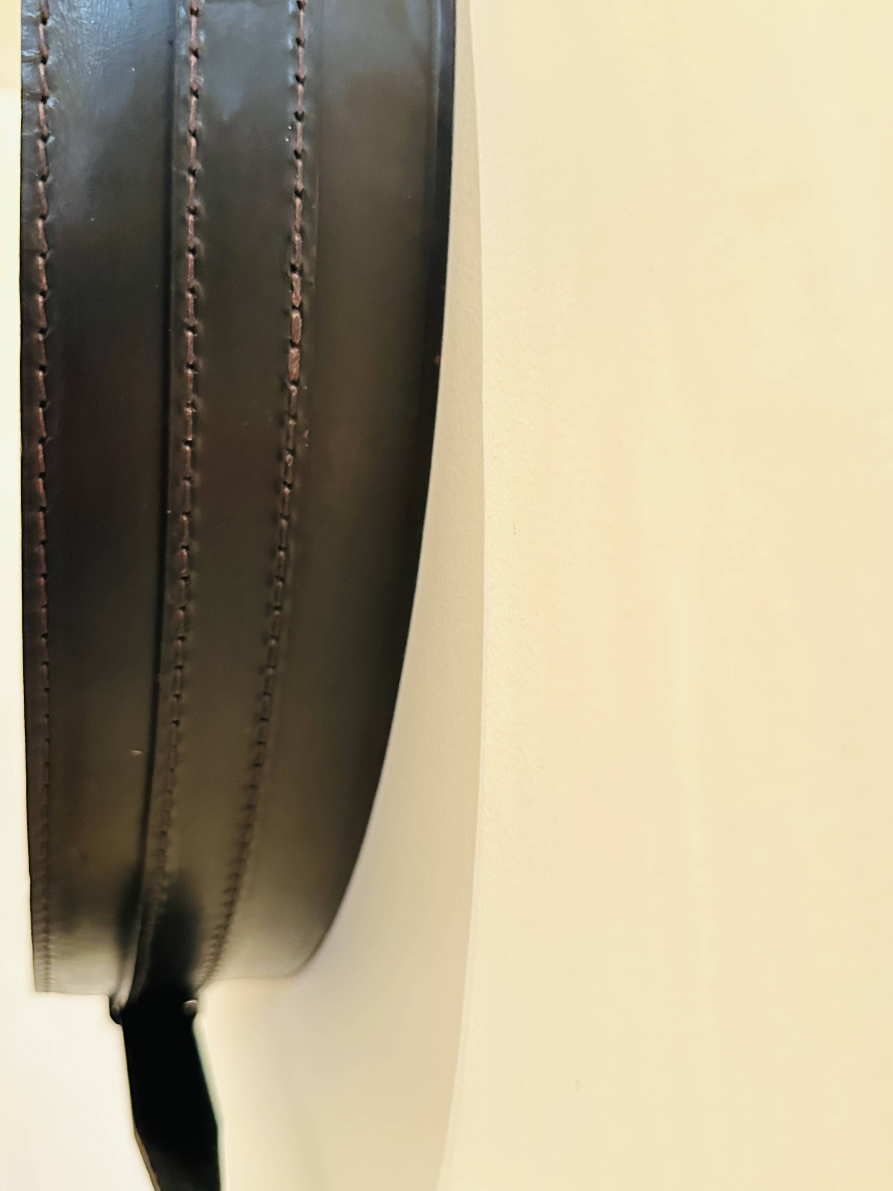 Jacques Adnet circular leather and brass mirror