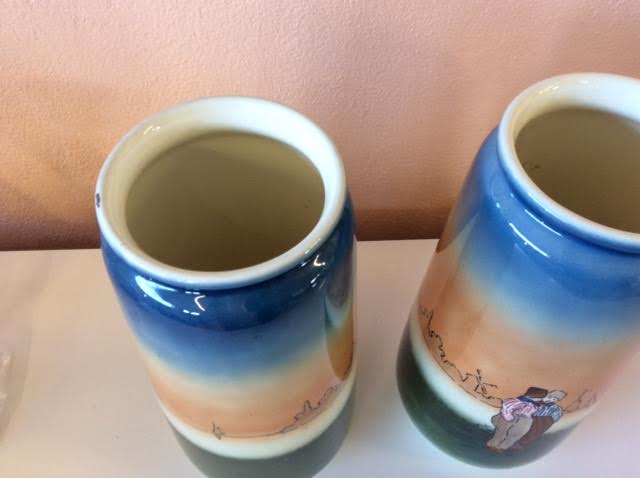 Pair of enamelled sandstone vases