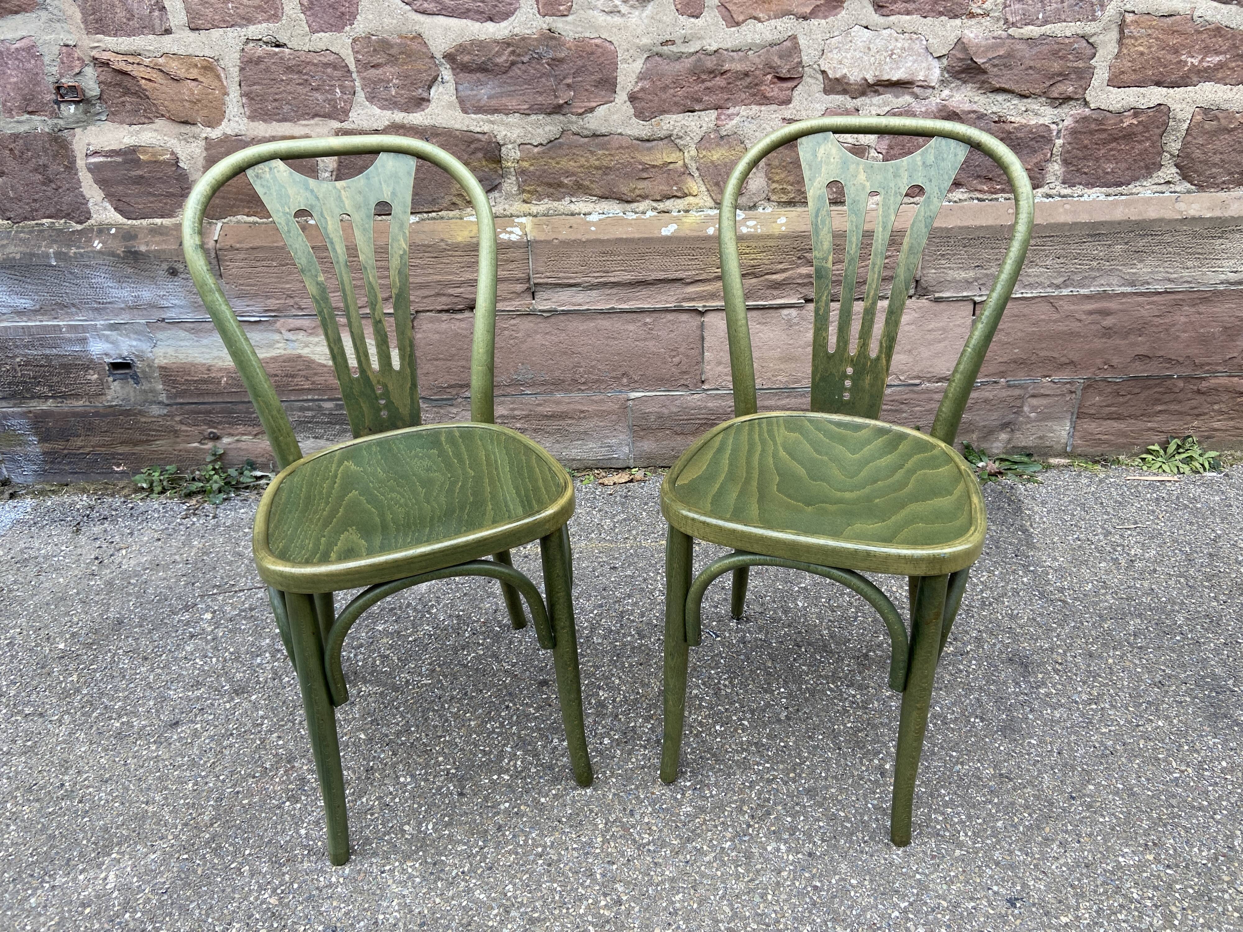 2 curved wooden bistro chairs