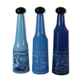 three blue bottles by Salvador Dali for Rosso Antico
