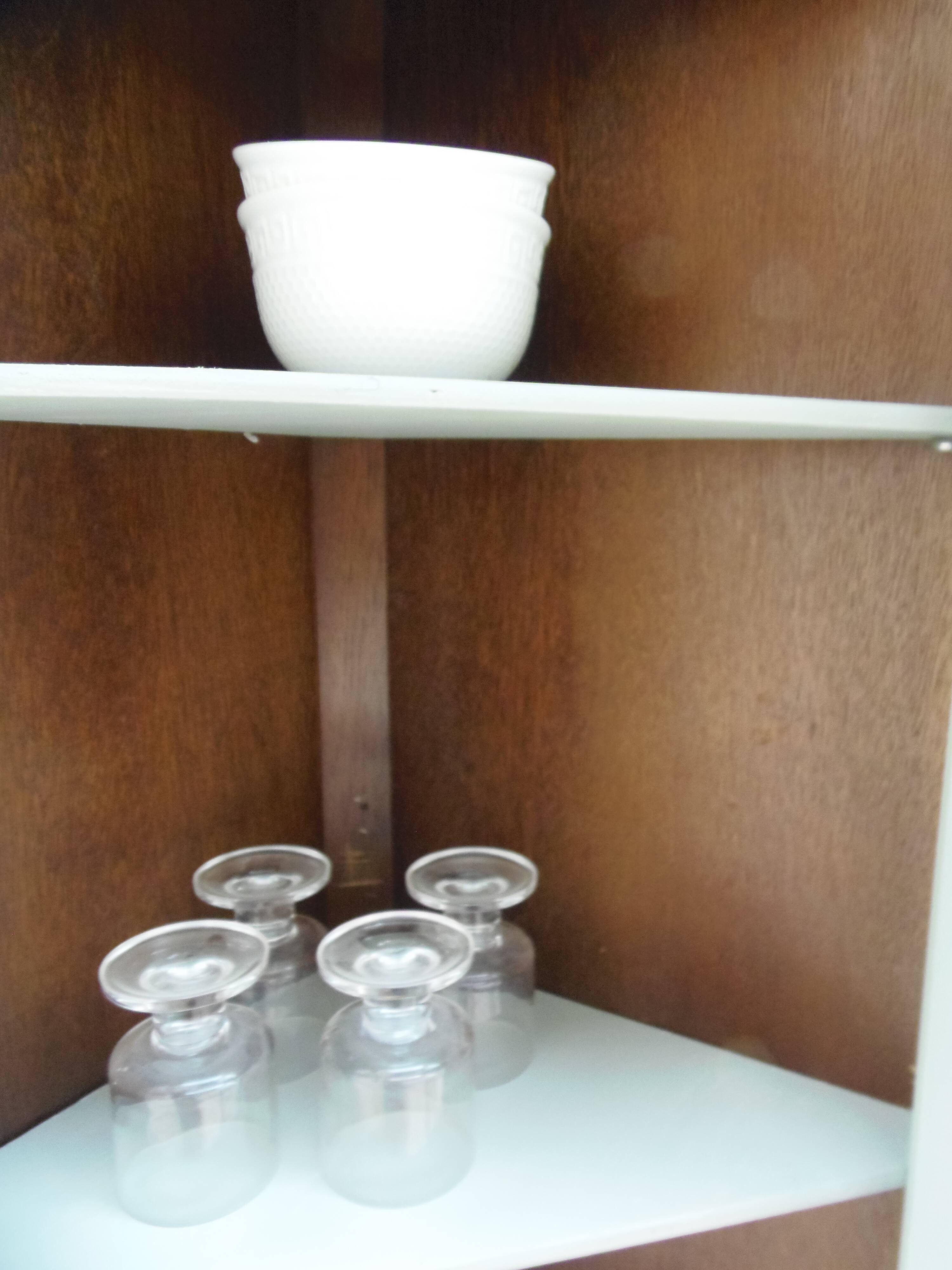 Vintage English corner display cabinet enhanced in grey-green with a wooden top.