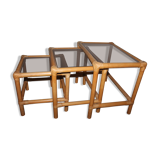 Rattan nesting tables in rattan and smoked glass from the 70s