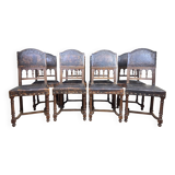 Set of 8 Renaissance style chairs in walnut and embossed leather