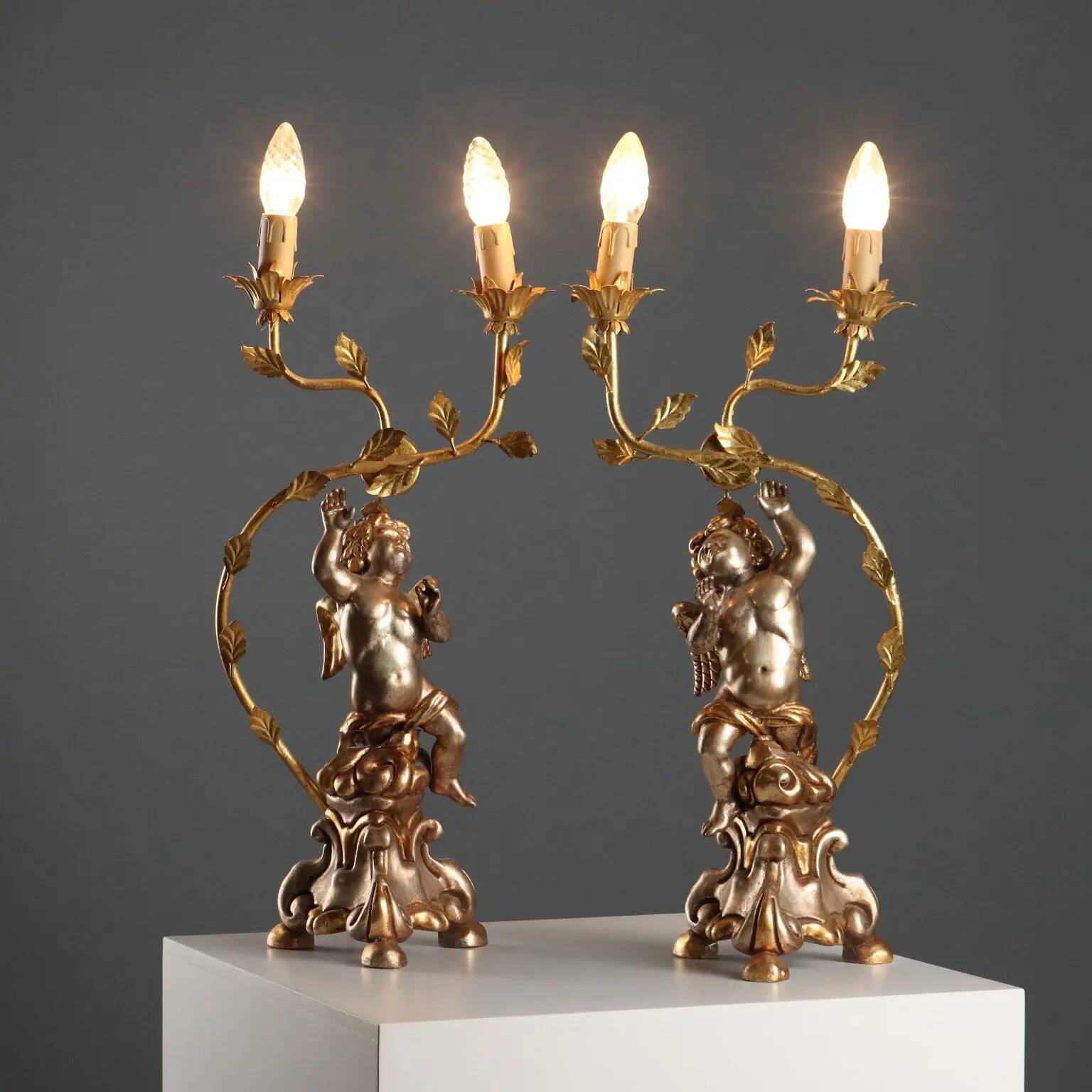 Pair of antique candelabra in carved and gilded wood, Italy, 20th century